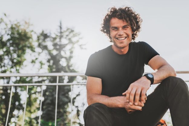 Motivational Interviewing man smiling and thinking about motivational interviewing