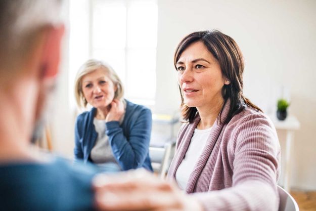 Trauma-Focused-Treatment Three people participate in trauma focused therapy