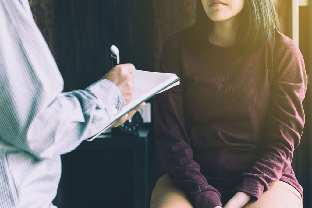 a woman talking to her doctor about what are co-occurring disorders