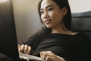 woman using laptop to look up the Rehab Admissions Process in oh