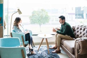 man talking to woman about the Residential Addiction Treatment Program in oh