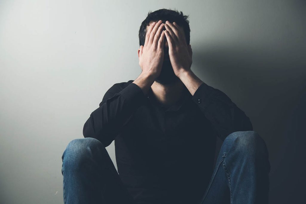 man struggling with alcohol withdrawal