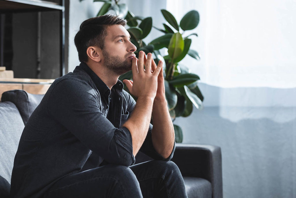 man deals with addiction detox symptoms