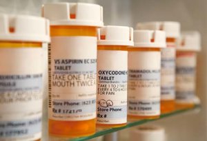 cabinet full of prescription bottles showing the need for Prescription Drug Addiction Treatment Program