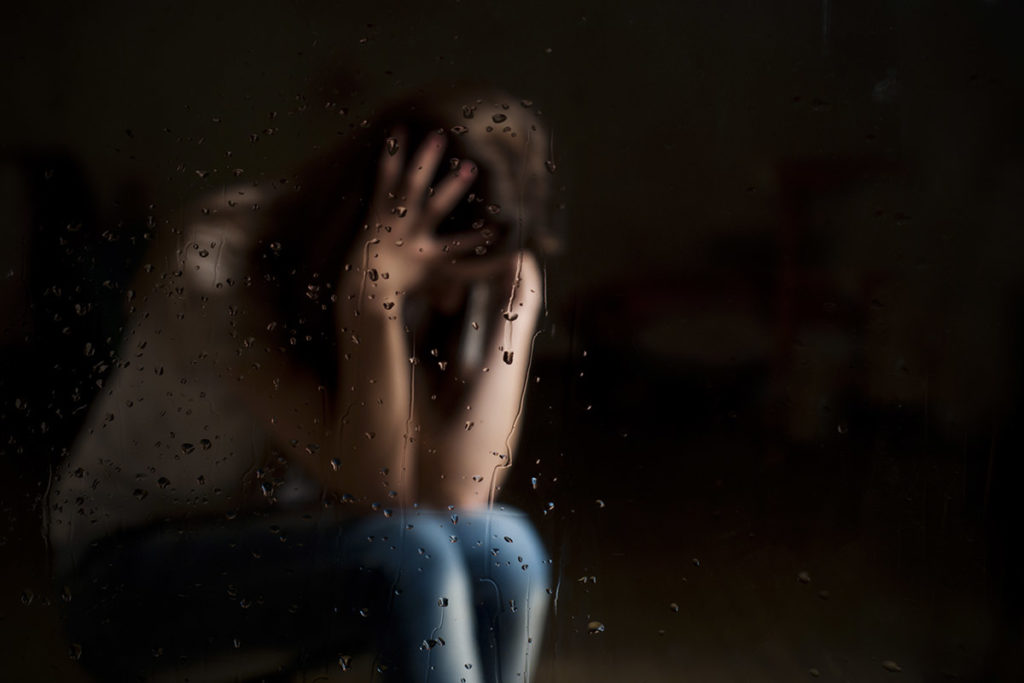 woman struggles with her trauma induced addiction