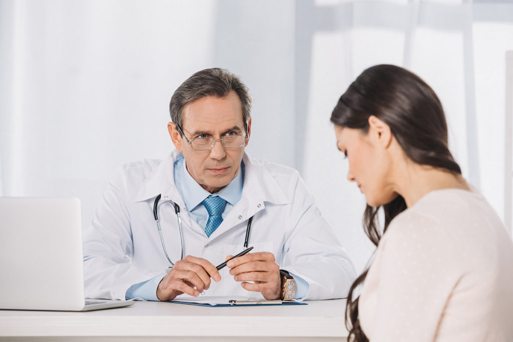 doctor explains heroin detox to an addict