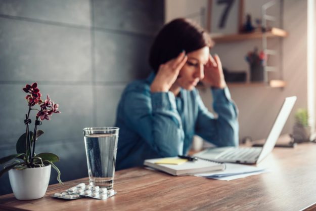5 Symptoms of a Painkiller Addiction woman struggling with the symptoms of painkiller addiction