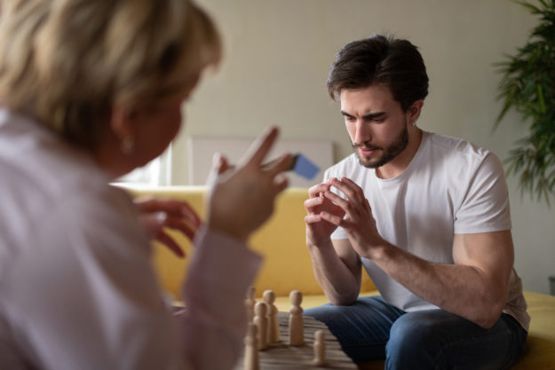 Stressed man listening to psychologist man learn about how detox affects him differently than women