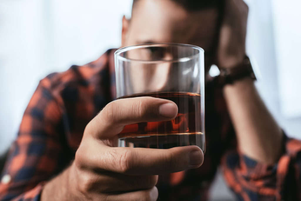 man thinks about whether or not his addiction warrants a detox