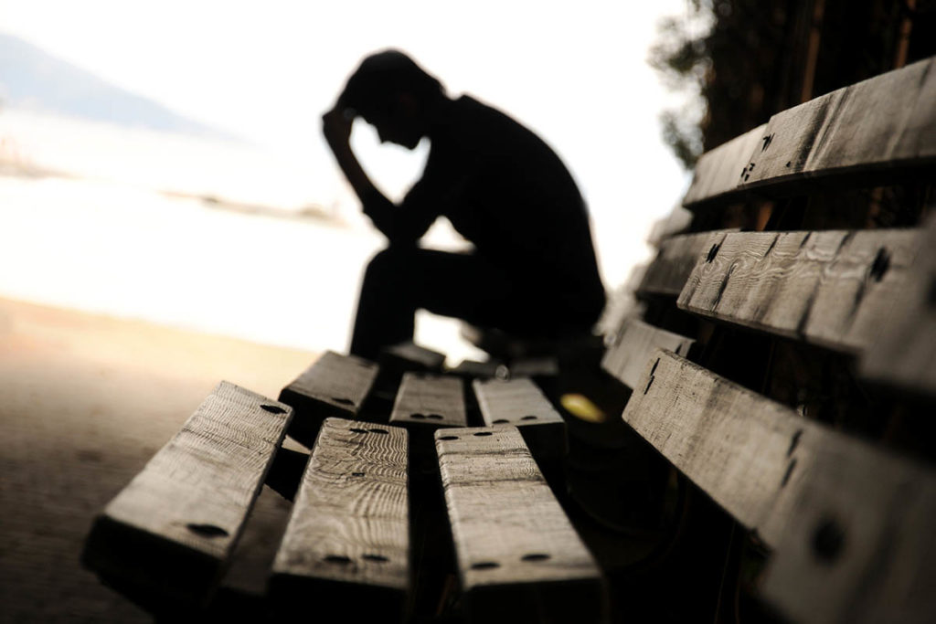 man deals with untreated anxiety that lead to addiction