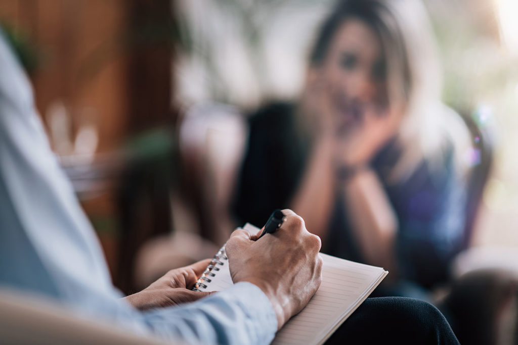 doctor tells woman about the different types of behavioral therapies