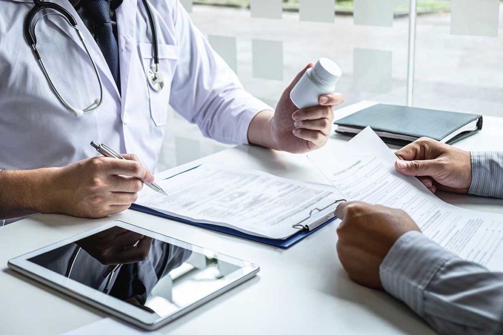 doctor gives drugs during medical detox
