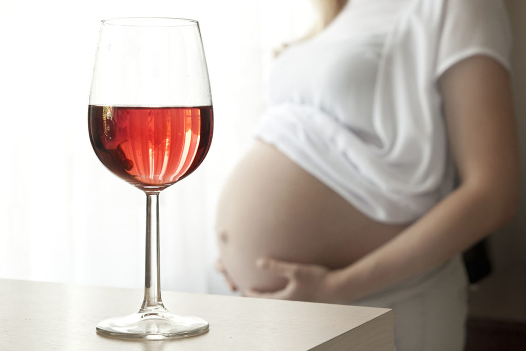woman tries not to drink while pregnant