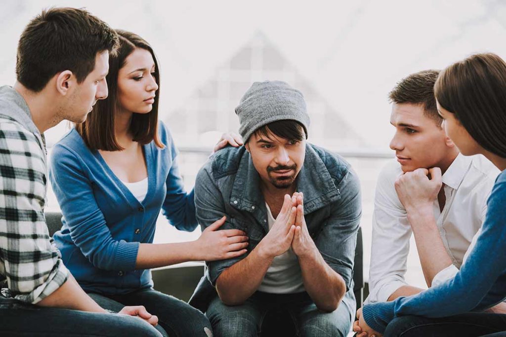 therapy group meets during first stages of meth addiction treatment
