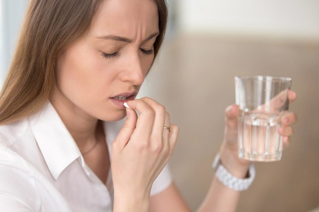 woman struggles with long term effects of pill addiction