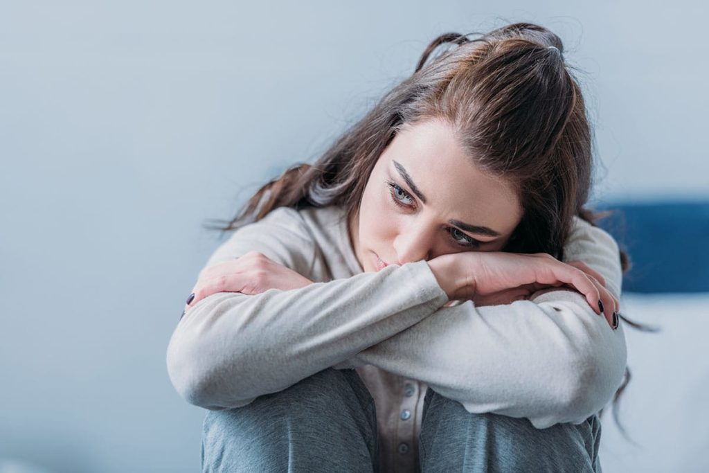 woman struggles with symptoms of xanax withdrawal