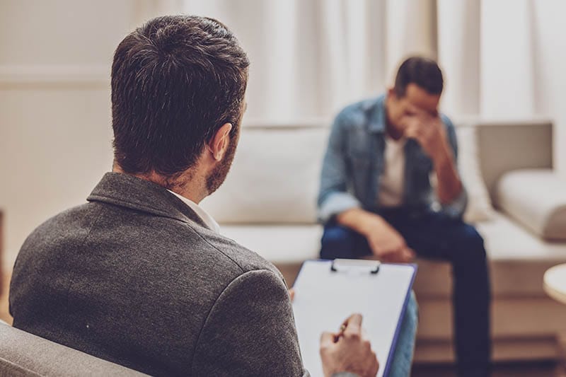 a man talking to his doctor about drug detox