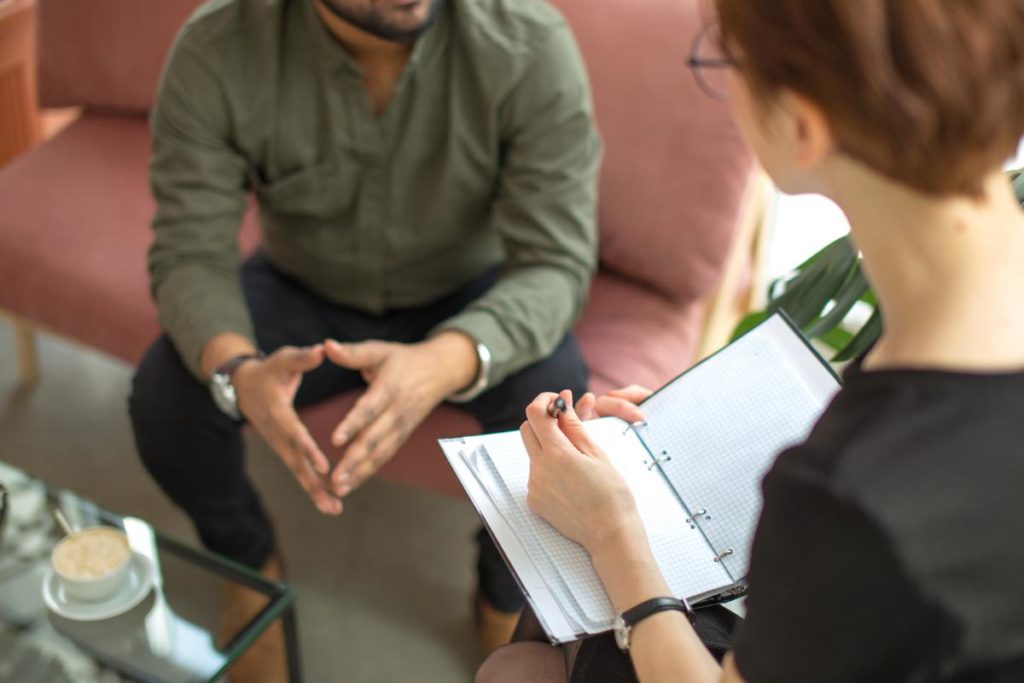 a man learning about the benefits of individual therapy program for addiction
