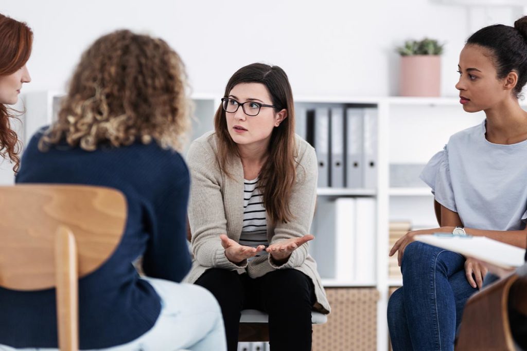 women in group therapy and substance abuse treatment program