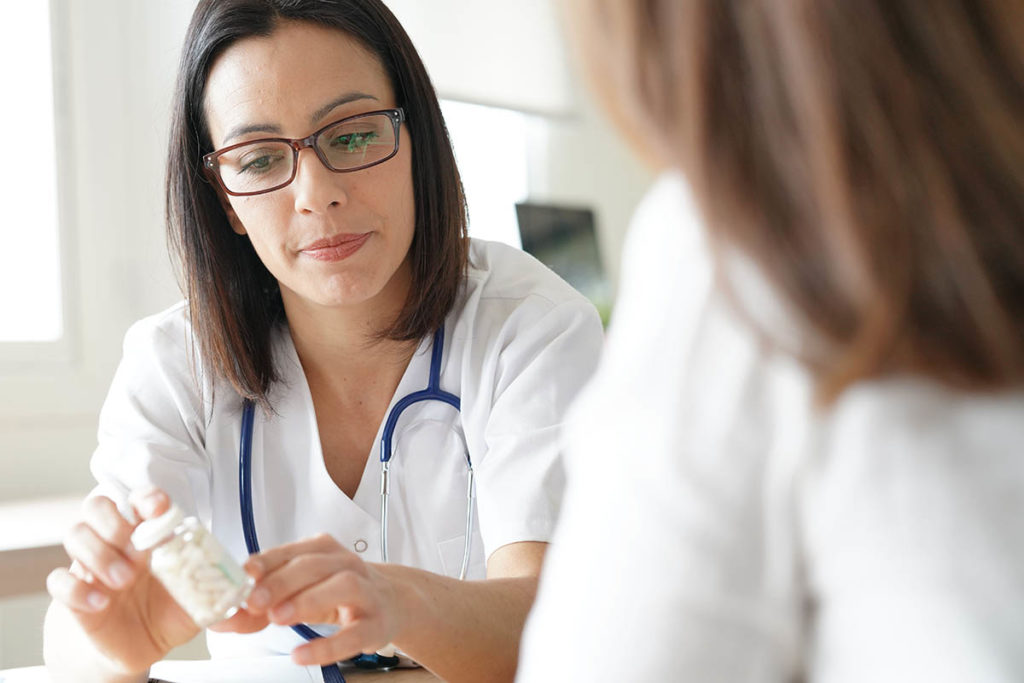 female doctor explaining detox medications