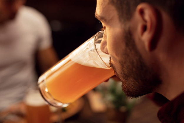 Self Checkin- Am I Binge Drinking man drinking beer as sign of binge drinking